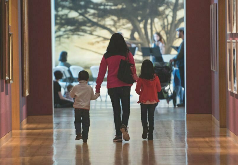 A family walking through the gallery