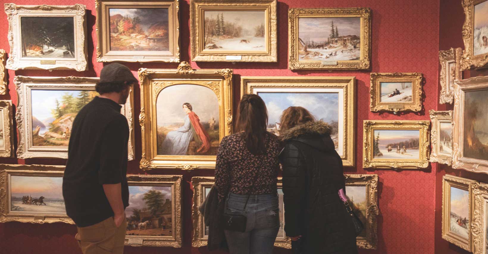 People looking at paintings